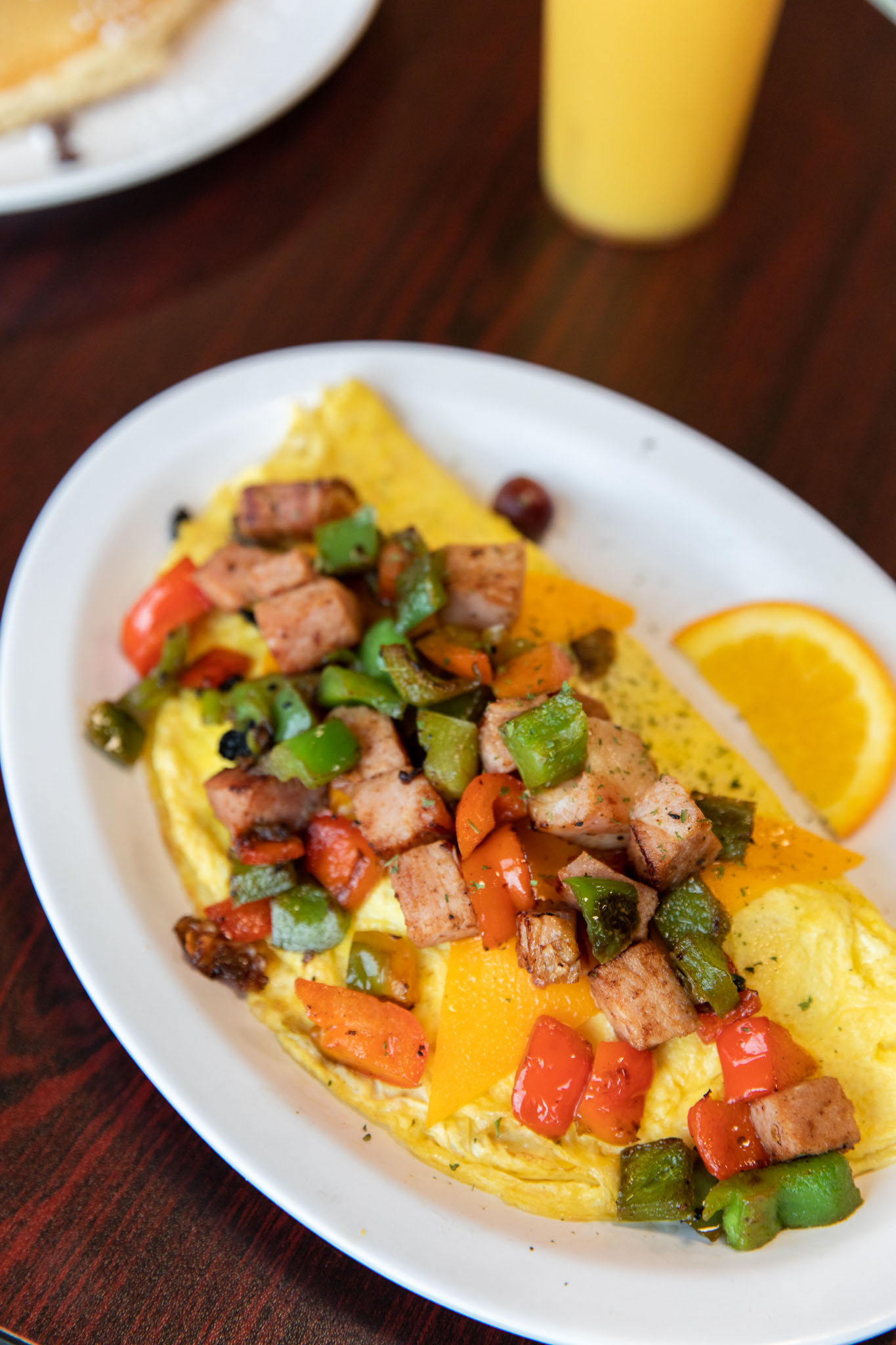 Cheese omelet topped with diced ham