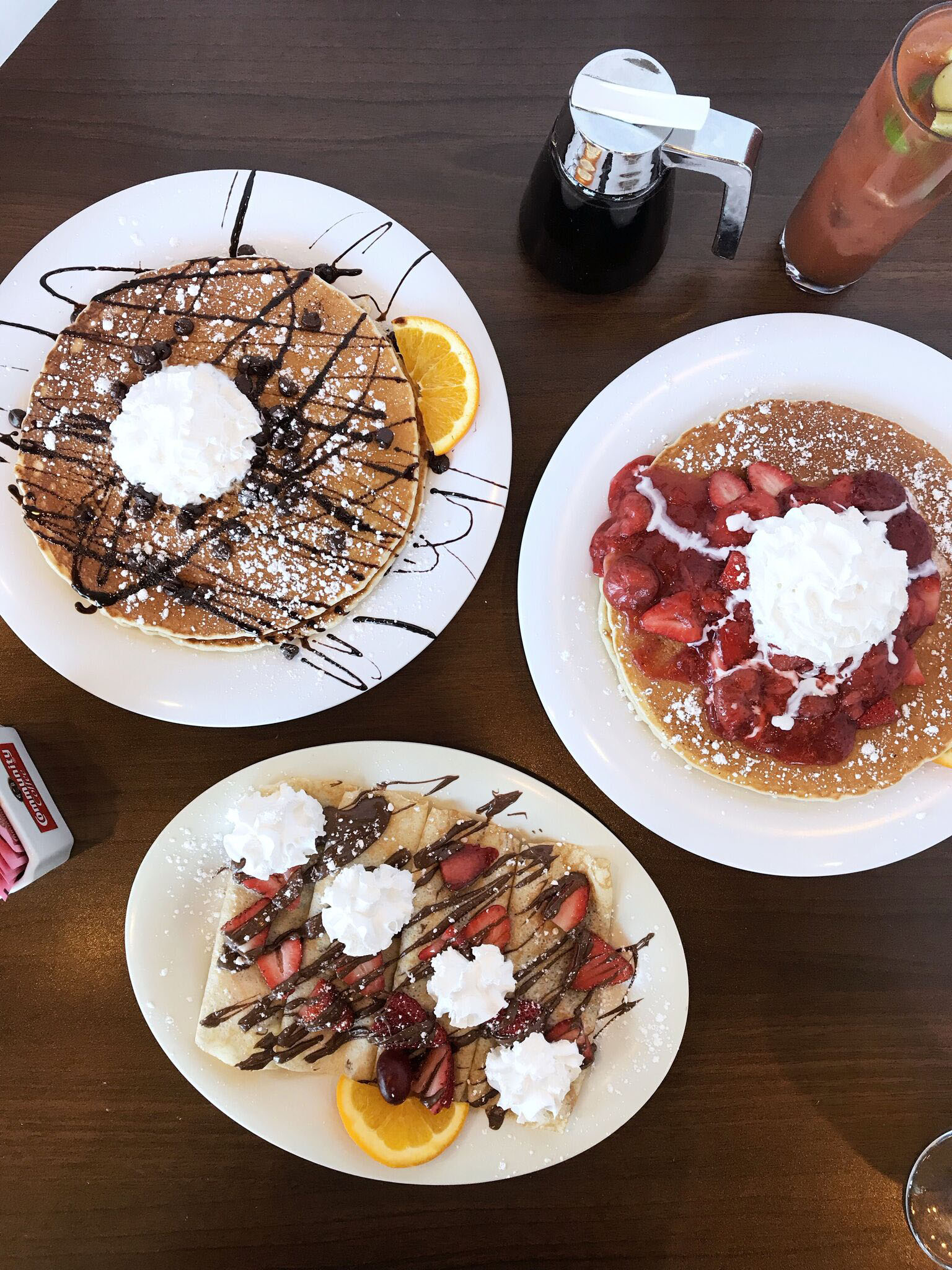 Breakfast spread featuring three different sweet dishes