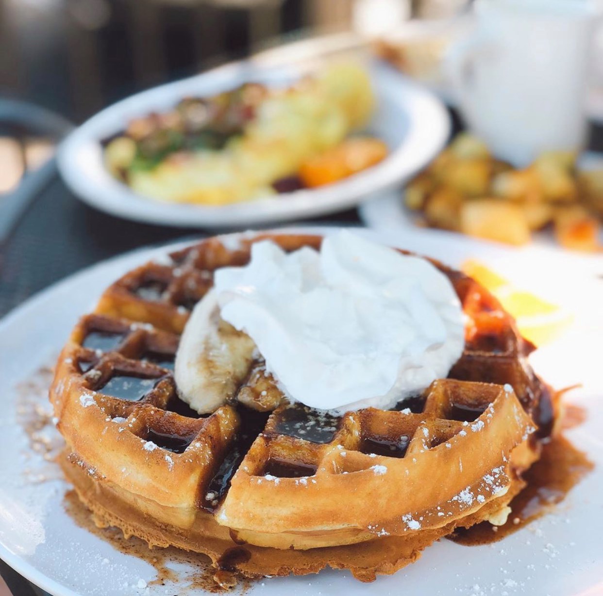Golden Belgian waffle topped with banana slices