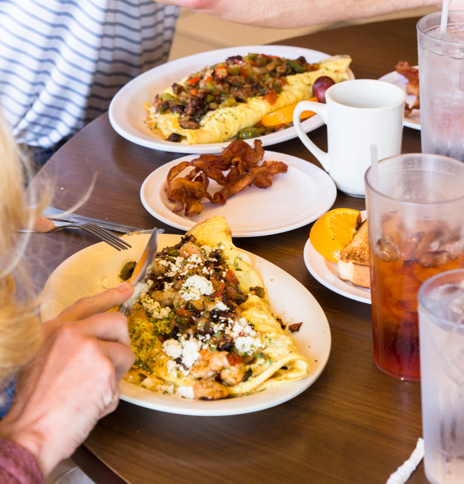 A table filled with hearty breakfast plates