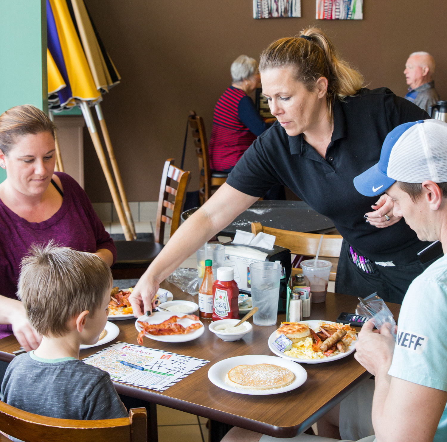 Team member serving at Brookers